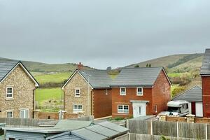 Picture #1 of Property #1483199541 in Greensands Way, Swanage BH19 1FD